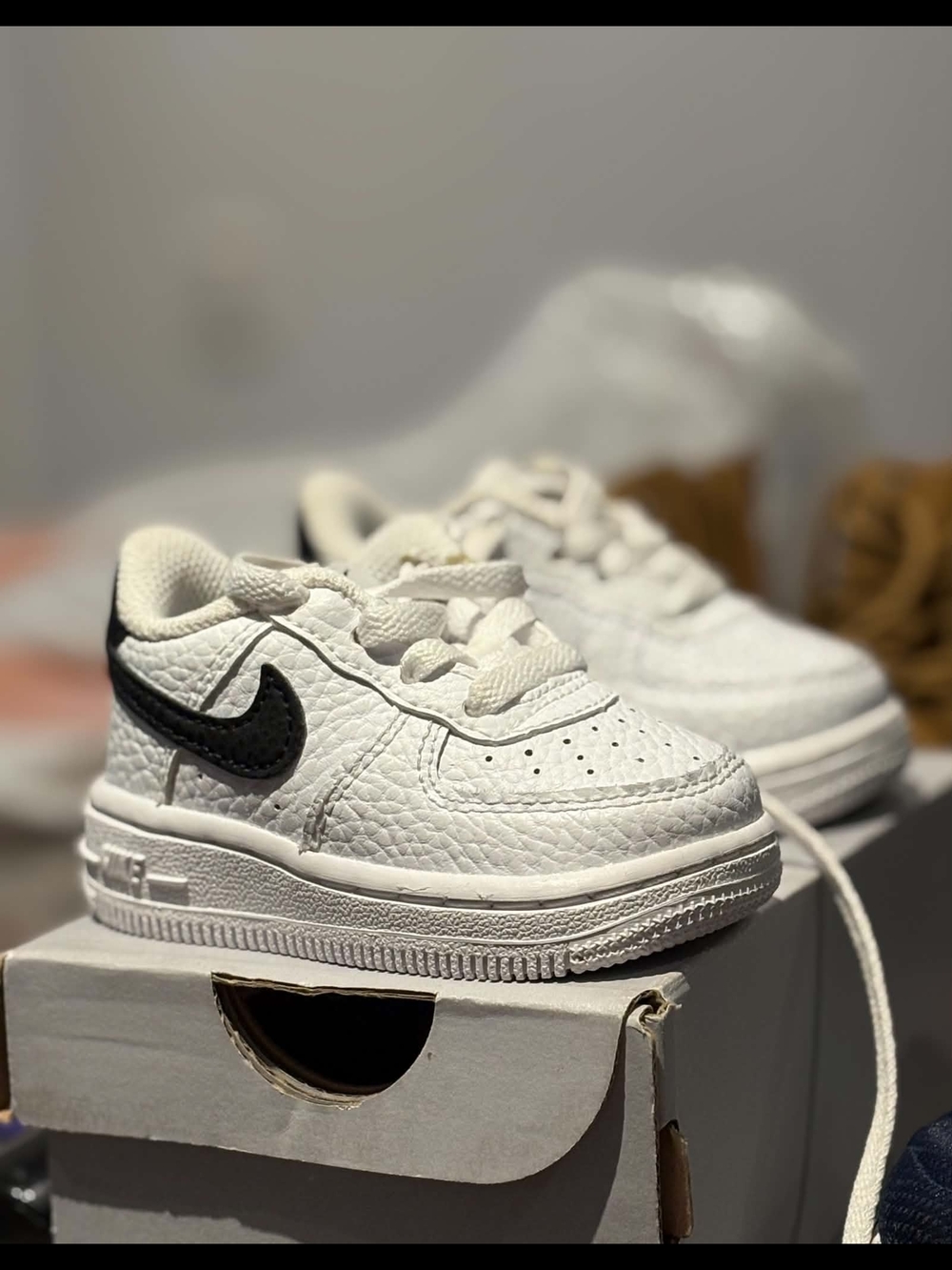 Nike Kids White Low-Top Sneakers with Black Swoosh